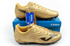 Ghete de fotbal sport Joma Evolution JR 2617 pentru gazon artificial și auriu Orlik